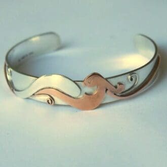 Silver bangle with silver and copper bird
