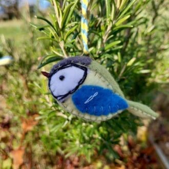 a handmade felt bird inspired by the Great tit