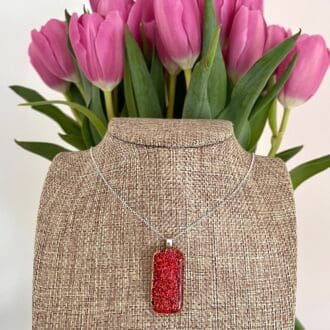 Sparkly red dichroic glass pendant on silver chain