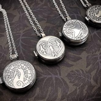 flat silver moongazing or leaping hare, bird or heart lockets