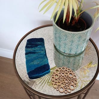 A lifestyle shot to show the felted glasses case on display.