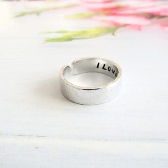 6mm width hammered textured aluminium cuff ring with a hidden message hand stamped inside