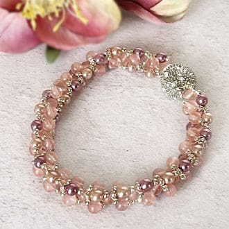 Beadwork bracelet in rose quartz gemstone beads and different shades of pink glass pearl beads