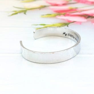 A 9mm wide aluminium adjustable bracelet with a personalised message hand-stamped inside