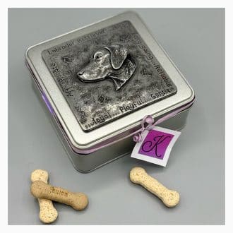 A square tinplate tin with a hand cast sculpted plaque on the lid showing a sculpted Labrador retriever head surrounded by inscribed words describing the breed. by kirsty Armstrong Sculpture
