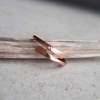 Adjustable copper wrap around ring with hammered tips, handmade by The Tiny Tree Frog Jewellery