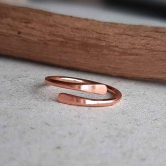 Adjustable copper wrap around ring with smooth tips, handmade by The Tiny Tree Frog Jewellery