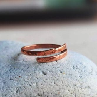 Adjustable slim band hammered copper wrap around ring, handmade by The Tiny Tree Frog Jewellery