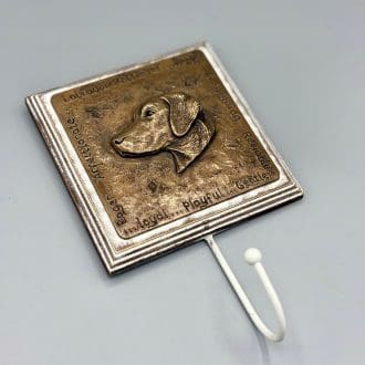 Dog lead hook featuring a square metallic plaque showing the sculpted head of a Labrador in relief and the words describing the breed characteristics inscribed around the edge. The single hook is mounted below the plaque. A choice of Copper, pewter and bronze finishes are available.