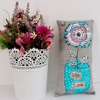 Pretty mini cushion with flower vase design. One of a kind home decor