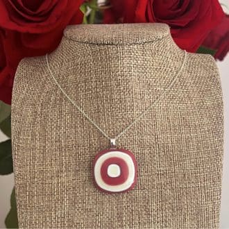 Large bullseye style chunky pink and cream glass pendant