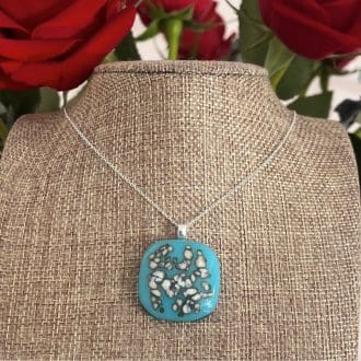 Duck egg or turquoise blue pendant with cream sprinkles