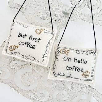Handmade cream wool felt hanging decoration for coffee lovers and enthusiasts. Free motion fun stitched message