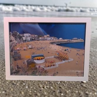A layered photo of Viking bay in Broadstairs Kent. The layers are cut so they stack to make the image 3D. It is in an A4 size white box frame.